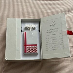 Swiss Arabian Perfume with Red and Silver Accents